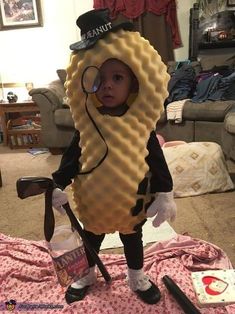 a young child dressed in a costume made to look like a hot dog and waffle