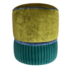 three different colored stools stacked on top of each other, one with blue and green stripes