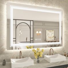 a bathroom with two sinks and a large mirror over it's sink area in front of the wall