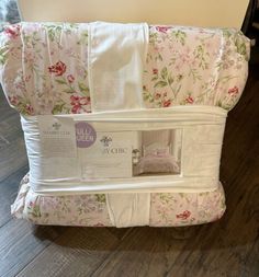 the baby crib is made with floral fabric