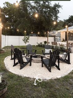 an outdoor fire pit surrounded by lawn chairs and string lights with the words how to build a backyard fire pit