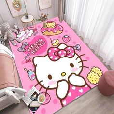 a hello kitty rug is on the floor in a room with pink furniture and accessories