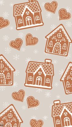 gingerbread houses and hearts on a gray background with snowflakes in the foreground