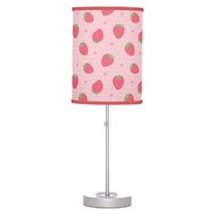 a pink lamp with strawberries on it and polka dot fabric shade for the lampshade