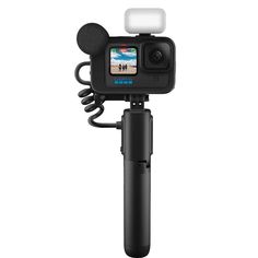 an action camera attached to a tripod with a microphone on the top and bottom