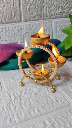 a small wooden candle holder on a bed