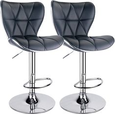 pair of black leatherette bar stools with chrome steel base and footrests