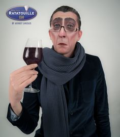 a woman holding a glass of wine in front of her face with the caption ratatoulie