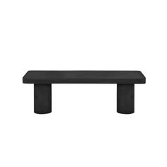 a black bench sitting on top of a white wall