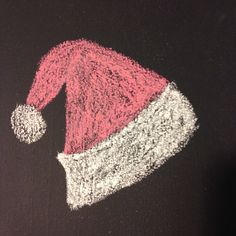 a chalk drawing of a santa hat on a blackboard