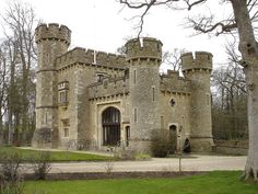 an old castle like building with a clock tower