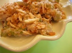 a white plate topped with food on top of a green table