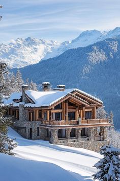 a house in the mountains covered with snow