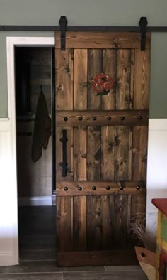 an open wooden door sitting inside of a room