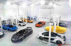 a bunch of cars that are in a room