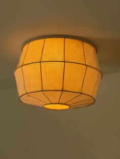 a lamp hanging from the ceiling in a room