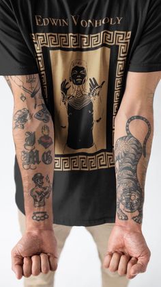 a man with tattoos on his arm and arms