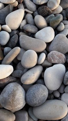 some rocks and pebbles are laying on top of each other