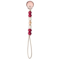 a pink and white pacifier with red beads on it's end, attached to a cord