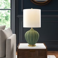 a living room scene with focus on the table lamp