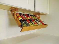 an overhead spice rack holds spices and seasonings