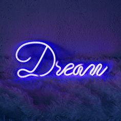 a neon sign that reads,'dream'in white letters on a blue background