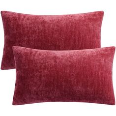 two red velvet pillows sitting next to each other