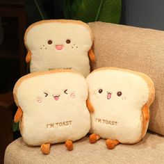 two toasted bread pillows with faces on them