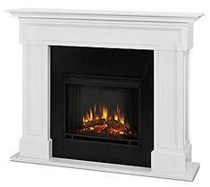 a white fireplace with flames in it