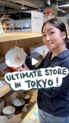 a woman holding up a bowl with the words ultimate store in tokyo