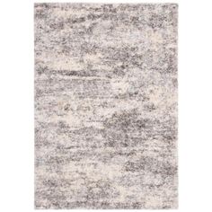 an area rug with grey and white colors