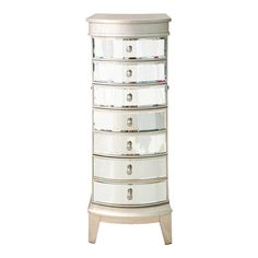 an image of a white jewelry cabinet with drawers on it's sides and glass doors