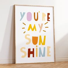 an art print with the words you're my sun shine in multicolored letters