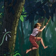 a girl climbing up a tree in the jungle