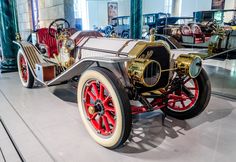 an antique car on display in a museum