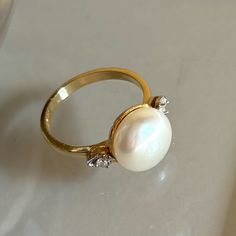 There Are Not Many Gemstones As Synonymous To Pure Elegance Than The Pearl. Termed The “Queen Of Gems,” Pearls Have For Civilizations On End Represented Prestige, Power, And Wealth. Like Its Long History, Pearls Have A Unique Way Of Making Its Wearer Look Elegant, Respectable, And Sophisticated. New, No Tag, Exquisite Ring 10.70mm Pearl In The Center With Diamonds On The Side Stamped Atl 14k Pearl Band Ring, Gold Ring With Pearl, Ring With Pearl, Turquoise Ring Engagement, Dream Wedding Ring, Freshwater Pearl Ring, Pearl And Diamond Ring, Pure Elegance, Pearl Design