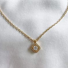 Make a statement with the cubic pave solitaire cubic zirconia pendant necklace. Perfect to wear alone or layer with other necklaces. 14k Gold Filled Chain 24k Gold Filled Charm Charm: 17mm x 12mm Chain length: 18" / 2.6mm thick Lobster clasp closure Hypoallergenic Water resistant & tarnish free Nickel & lead free Gold Neck Chain, Real Gold Necklace, Double Chain Necklace, Indie Jewelry, Magical Jewelry, Pearl Necklaces, Neck Chain