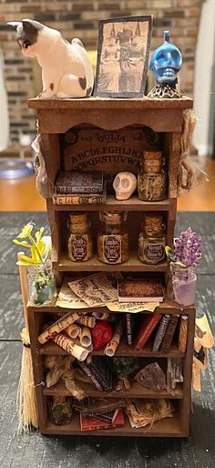 an old book shelf is decorated with various items