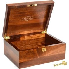 an open wooden box with a key in it