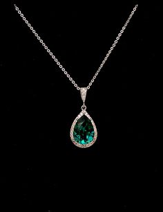 Tarnish resistant white gold plated metal framed teardrop luxury genuine Swarovski emerald green foiled back rhinestone teardrop and white gold plated metal bail with cubic zirconia deco. Comes with 16 or 18 inch sterling silver chain. Pendant size with bail : 3.cm x 1.3cm Matching earrings available and sold separately. Emerald Green Quince Necklace, Emerald Green Wedding Jewelry, Green Silver Jewelry, Gold And Emerald Necklace, Tas Louis Vuitton, Emerald Green Jewelry, Necklace Prom