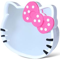 a hello kitty shaped mirror with pink and white polka dots on the front of it