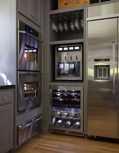 a stainless steel refrigerator with wine bottles in it