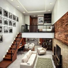 a living room filled with furniture next to a fire place under a stair case on top of a hard wood floor