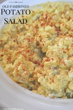 an old fashioned potato salad in a white bowl on a table with the words old fashioned potato salad