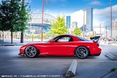 a red sports car parked on the street