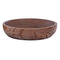 a wooden bowl with carved designs on it