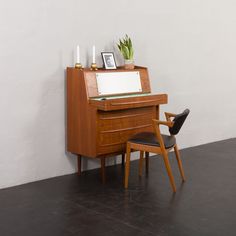 a chair sitting next to a wooden piano