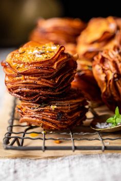 a stack of pancakes sitting on top of a cooling rack