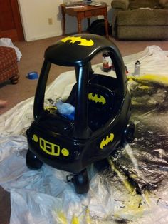 an inflatable batman car is sitting on the floor