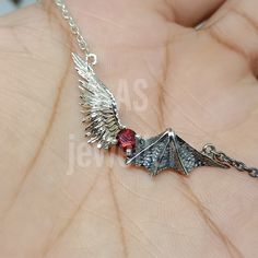 Description Brand: AS Jewellers Country/Region of Manufacture: India Metal : Sterling Silver Metal Purity : 925 parts per 1000 Main Stone: Garnet Chain Length : 18 Inches Feel free to contact me. Thank You for visiting. Memory Necklace, Stone Angel, Guardian Angel Necklace, Gothic Bracelet, Angel Wing Necklace, Angel Jewelry, Angel Necklace, Catholic Jewelry, Wing Necklace